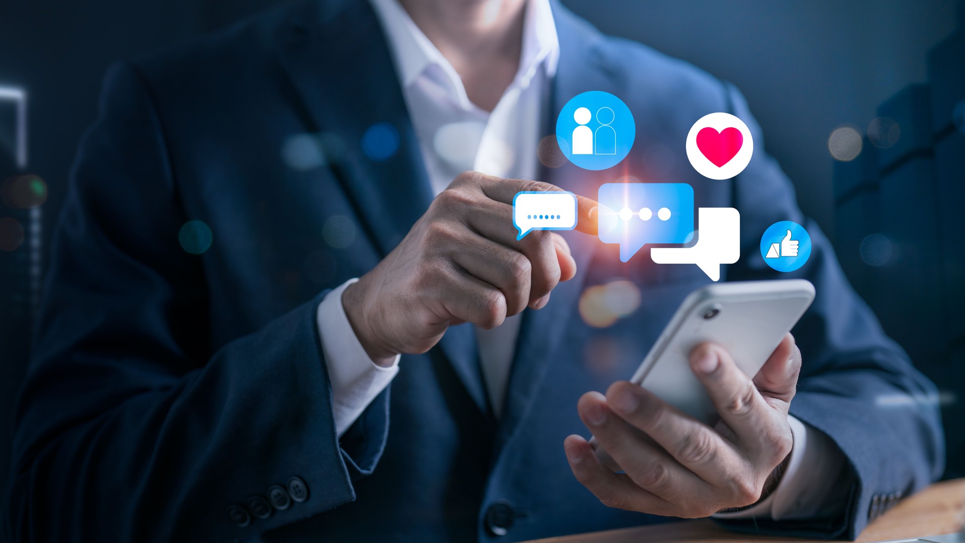 Digital business concept with social media interaction, businessman touching chat bubble and heart icon, online presence, mobile engagement, social networking and branding
